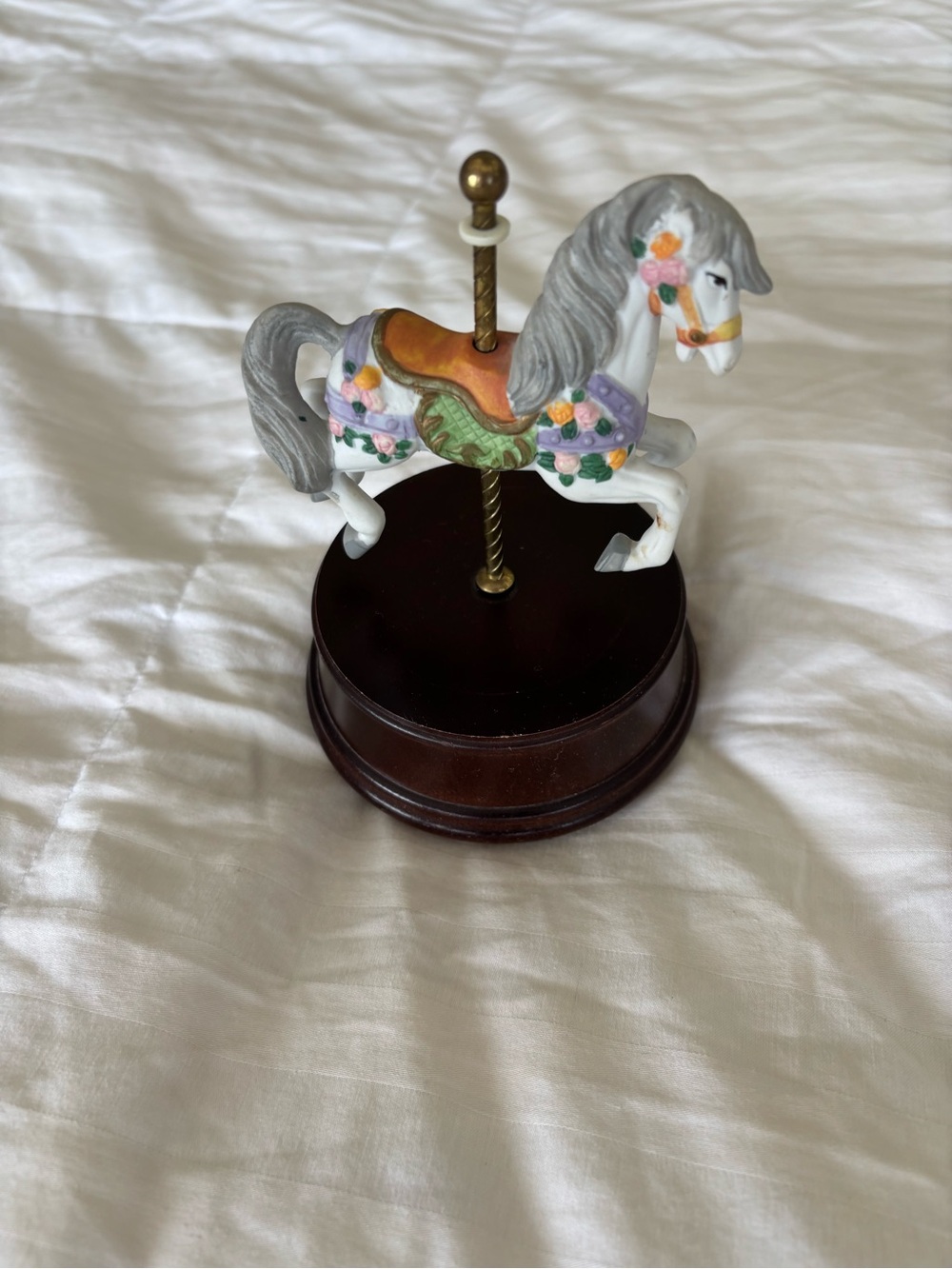 vintage carousel horse music box 
white ceramic horse